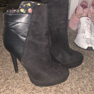 Black booties with zippers on the back